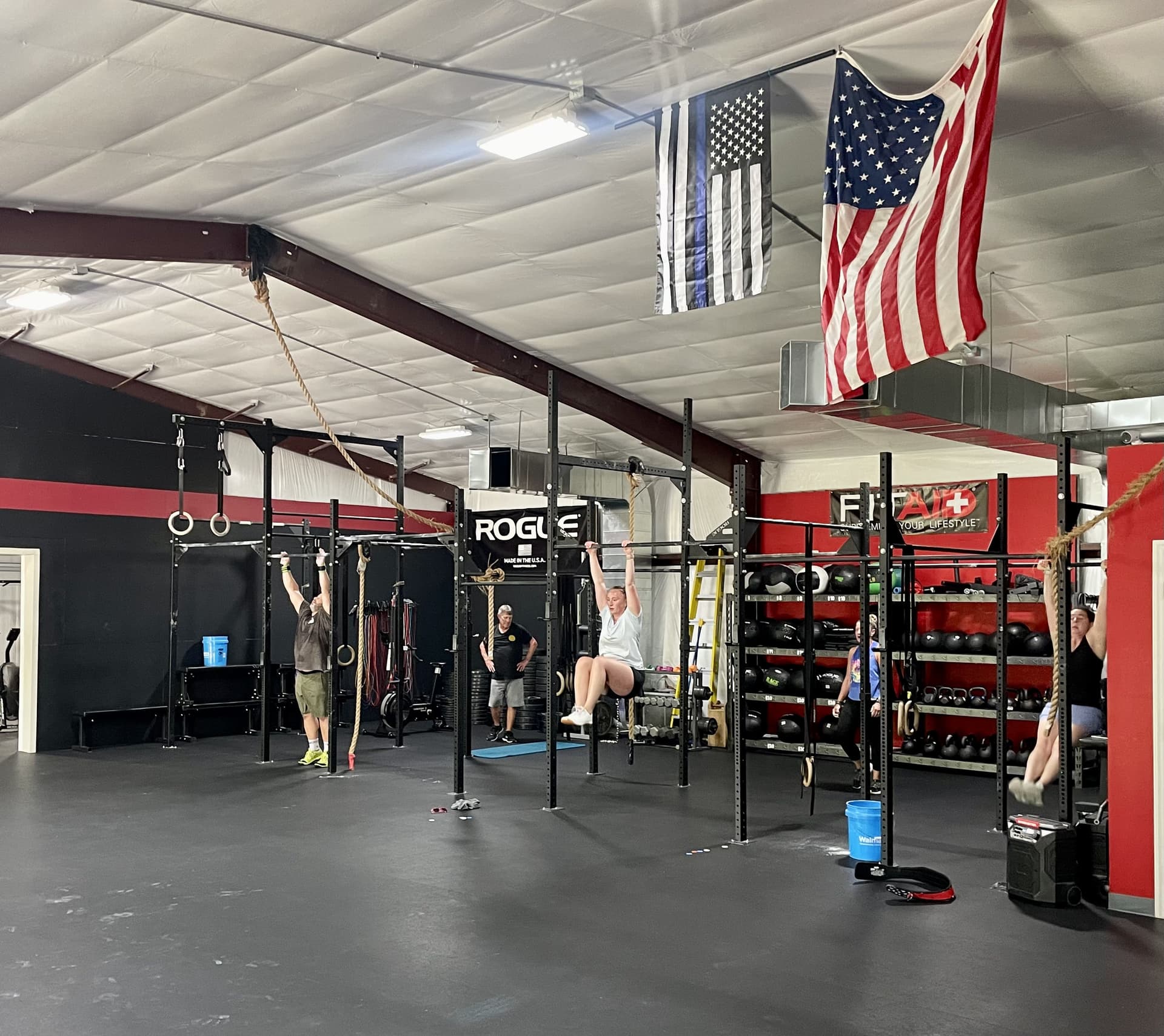 Chair City Fitness coaches training members during a class