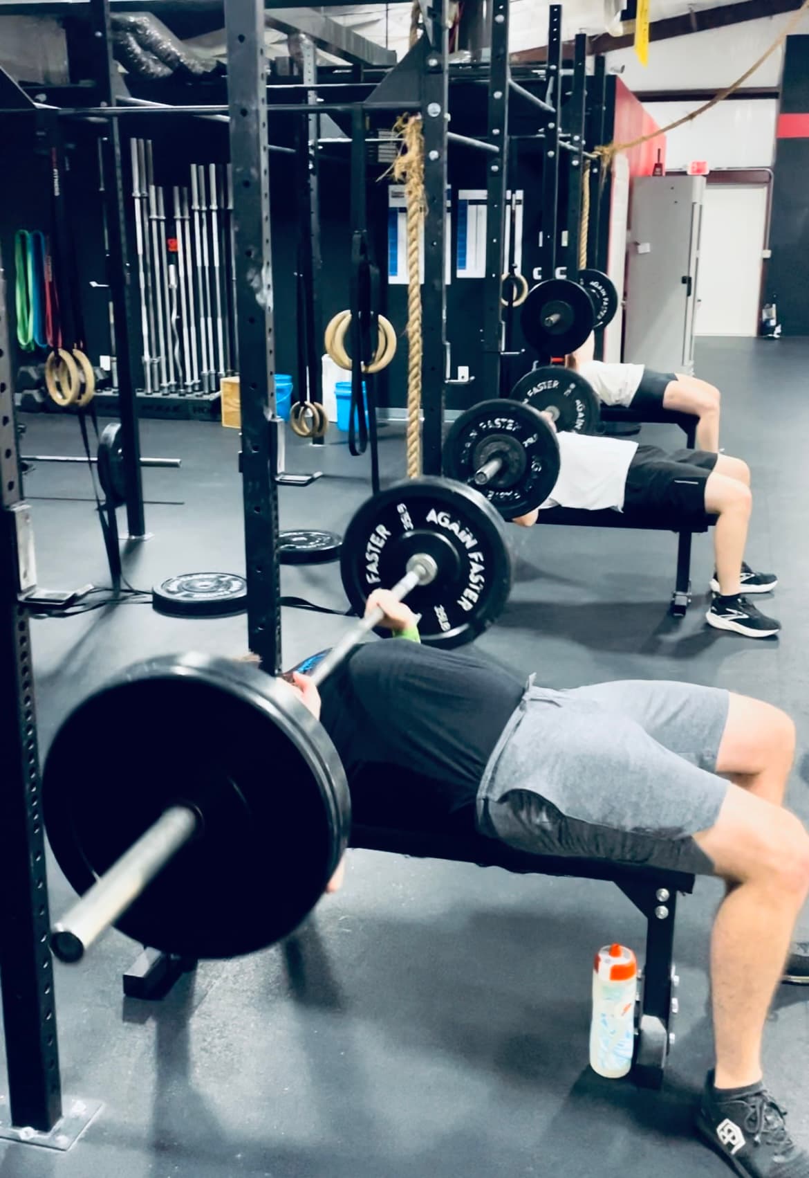 A female athlete at Chair City Fitness prepares for a clean and jerk